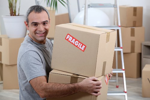 Office relocation planning in Ealing with moving boxes and desk setup