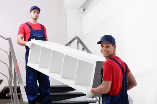 Local moving team handling furniture in Ealing