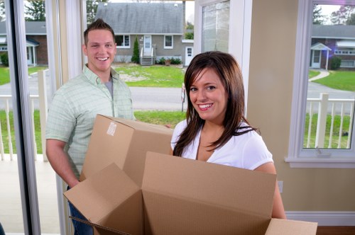Removal team loading household items for a UK moving service