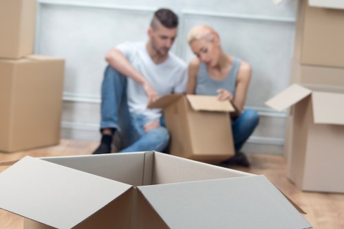 Packed moving boxes and furniture prepared for transport